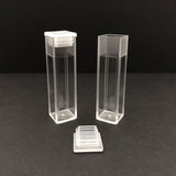 One closed cuvette and one open cuvette for fluorescence and absorption measurements in spectrometer instrumentation 